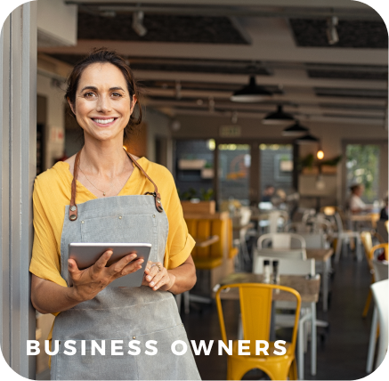 Business owner in cafe holding tablet