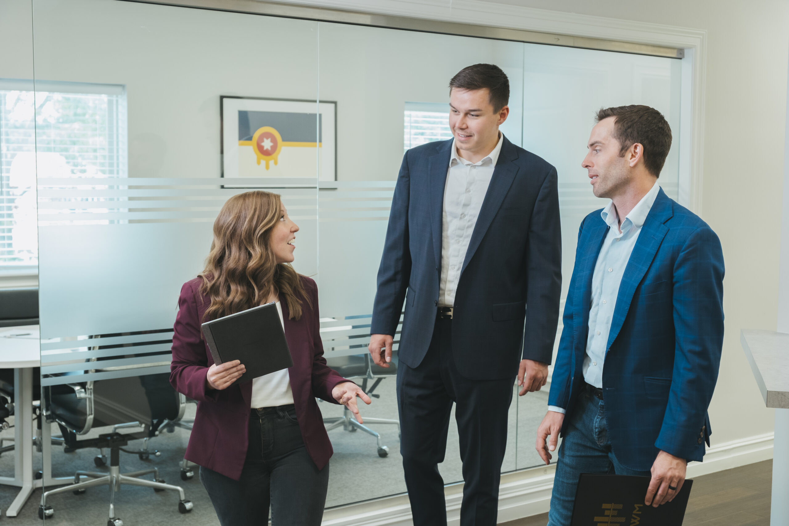 Burkholder Wealth Management team sitting at table